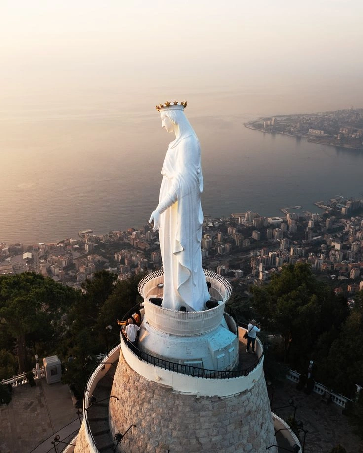 Statue of Our Lady of Lebanon in Harissa overlooking Jounieh Bay at sunset