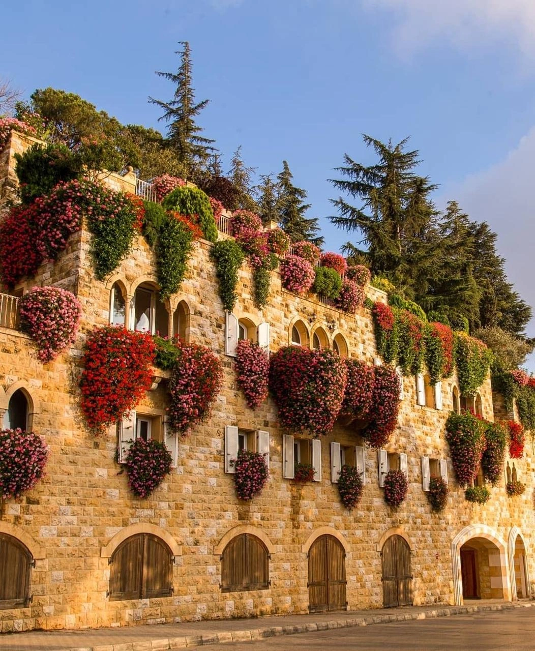 Traditional stone houses in Broumana, Metn, with colorful flower-covered balconies and cafés