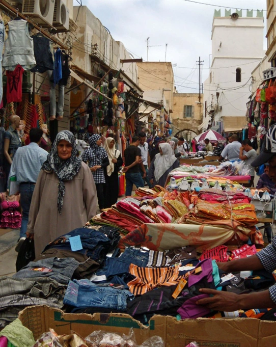 Narrow alley with shops in Tripoli's old souks